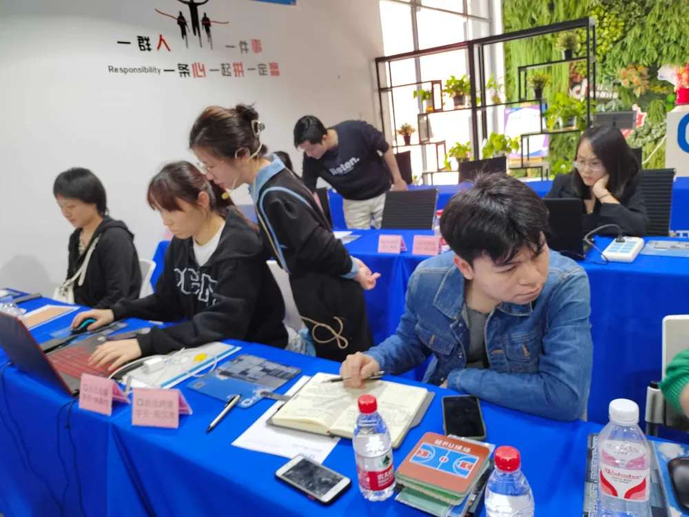 Expeditious cross-border trainees do real class work in front of the computer.